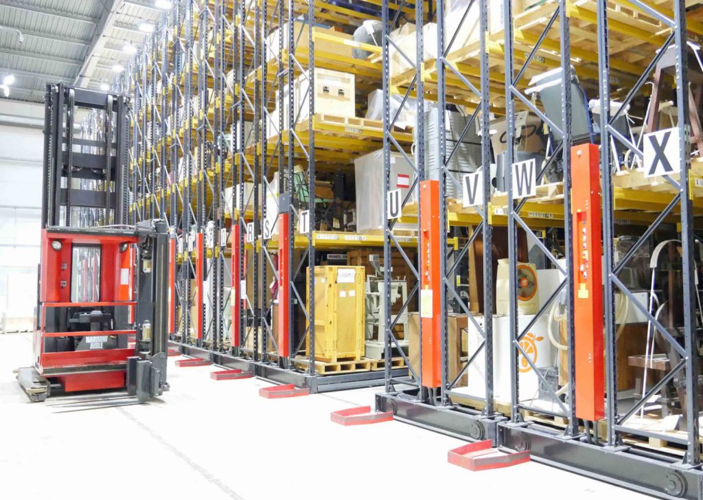 Colour photograph showing collections storage in racking within a warehouse
