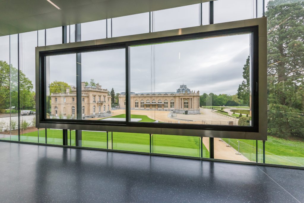 Colour photograph of a view of an old museum from the visitors pavilion of an adjacent museum
