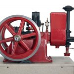 Colour photograph of a horizontal single cylinder petrol engine designed to power farm equipment and workshop tools