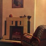 Colour photograph of a living room fireplace with a smokeless hearth