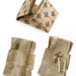 Colour photograph of a breverl composite amulet in various stages of unfolding