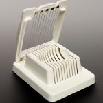 An egg slicer with steel slicing strings used with a contact microphone by electro-acoustic musician Hugh Davies