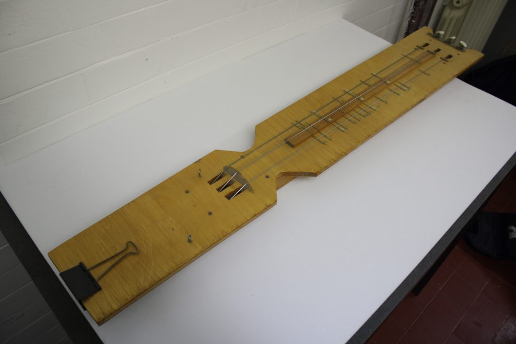 Colour photograph of a self built stringboard instrument by Hugh Davies
