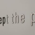 Colour photograph of a museum label that says everything passes except the past