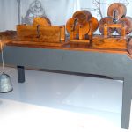 Colour photograph of a wooden model of a design by Leonardo da vinci for testing friction