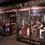 Colour photograph of a lifesize model of the shop front of a victorian era chemists