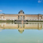 Colour photograph of a view of the Royal Museum of Central Africa from the adjacent lake