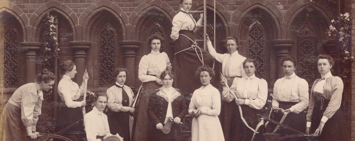 Sepia photograph of the Girton College Cambridge fire brigade featuring Hertha Ayrton from 1880