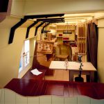 Colour photograph of the interior of a scale model of the chemistry laboratory of HMS Challenger 1872 to 1876