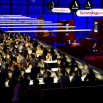 Elevated view photograph of seated adults taking part in a pub quiz during on the of the Science Museum Lates