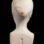 Reverse view of miniature phrenology bust showing inscription