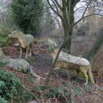 Colour photograph of three concrete anoplotherium models from the nineteenth century