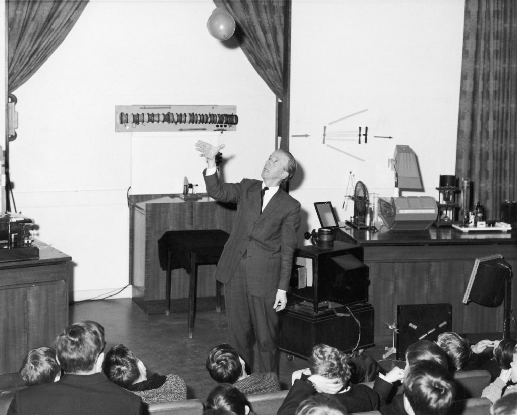 Black and white photograph of Major Wall giving a lecture demonstration to school children in 1969