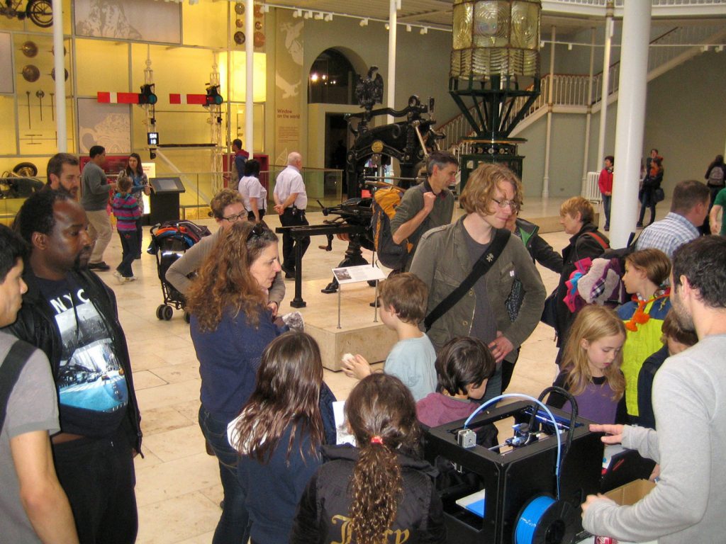Colour photograph of a 3d printing demonstration inside a museum