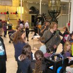 Colour photograph of a 3d printing demonstration inside a museum