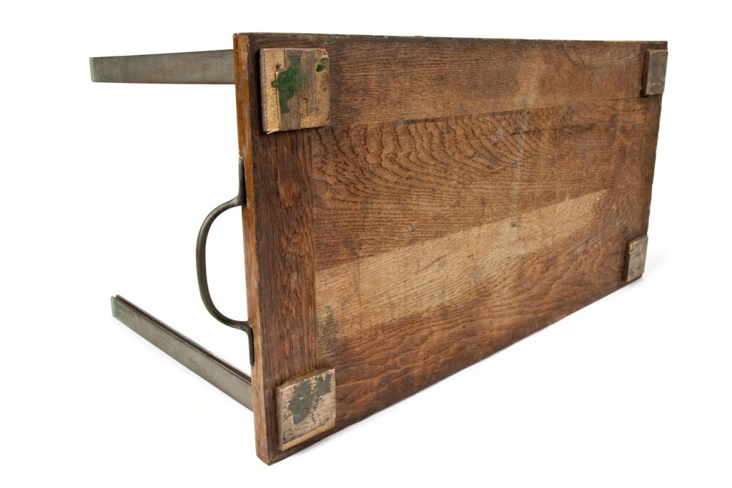 Colour photograph of the wooden underside of a 1950s three dimensional chart showing electricity demand over time