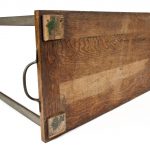 Colour photograph of the wooden underside of a 1950s three dimensional chart showing electricity demand over time