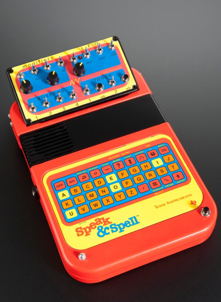 Colour photograph of a speak and spell childrens toy that has been modified to create music