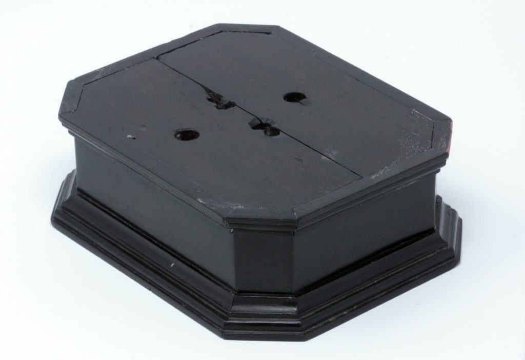 Base of the clock, showing contemporary fixings