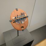 Colour photograph of a Kalimba instrument in a museum gallery
