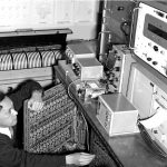 Black and white photograph of Shizuo Ishiguro with his electronic storm surge modelling machine