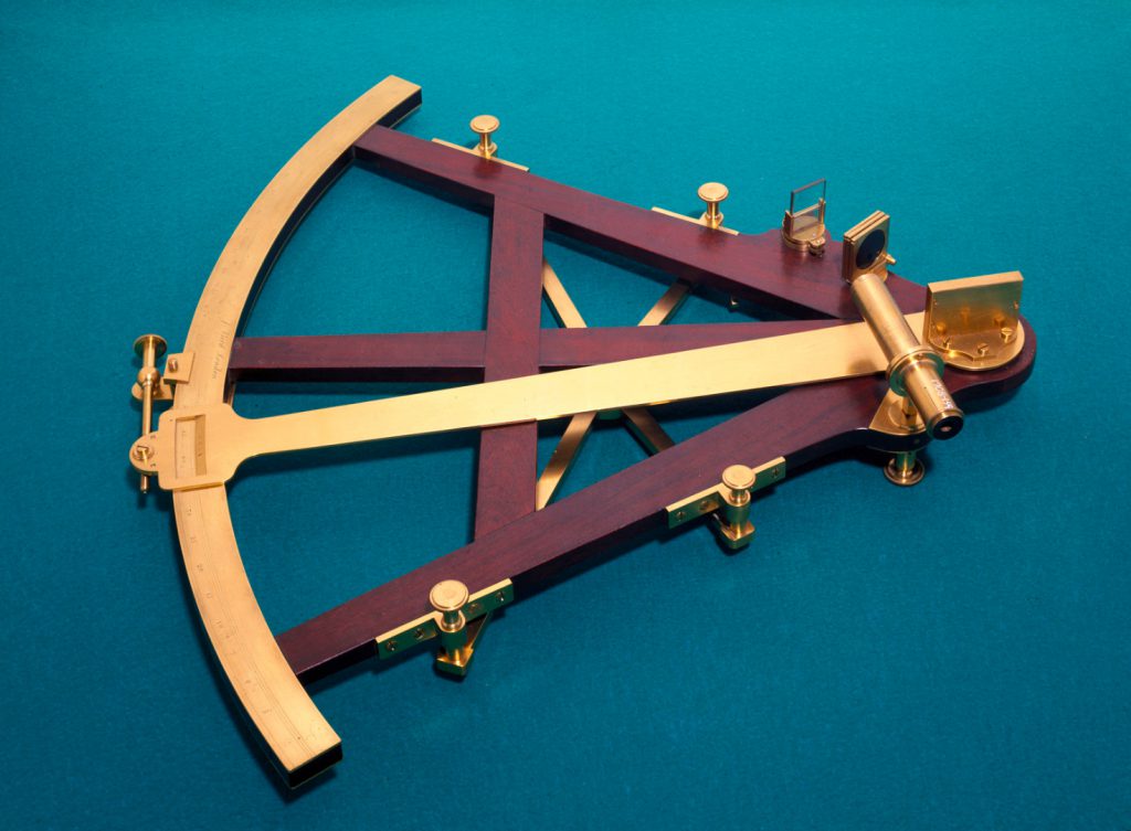 A wood and brass sextant from 1772