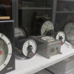 Colour photograph of a number of dials and meters in museum storage