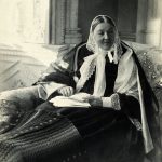 Black and white full figure seated portrait photograph of Florence Nightingale