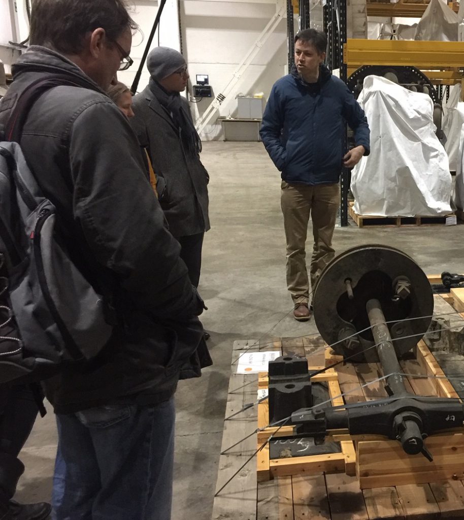Colour photograph of people visiting the museum collections warehouse
