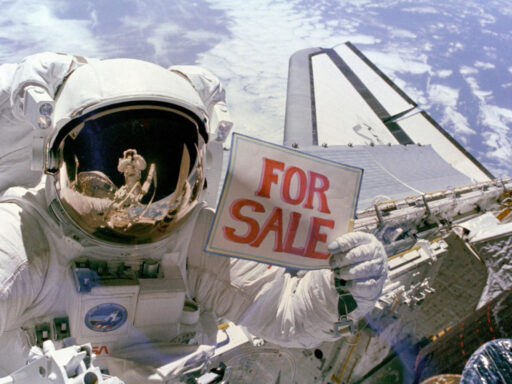Colour photograph of an astronaut in space floating above a spacecraft and holding up a sign which reads for sale