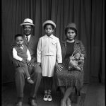 Black and white photograph of a family photographed at Belle Vue Studio Bradford in 1950