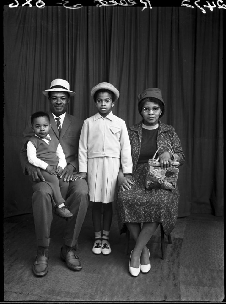 Black and white photograph of a family photographed at Belle Vue Studio Bradford in 1950