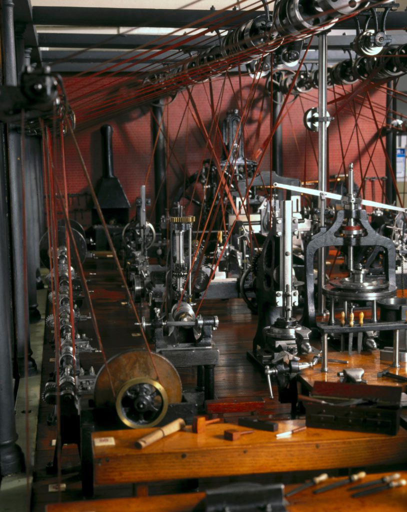 Colour photograph of detail of a miniature machine workshop model from late 1800s on display in the Science Museum London