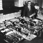 Black and white photograph of the Hartree differential analyser with Douglas Hartree and Arthur Porter