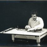 Black and white photograph of Hugh Davies with Shozyg I Uher mixer and clarinet pictured July 1968