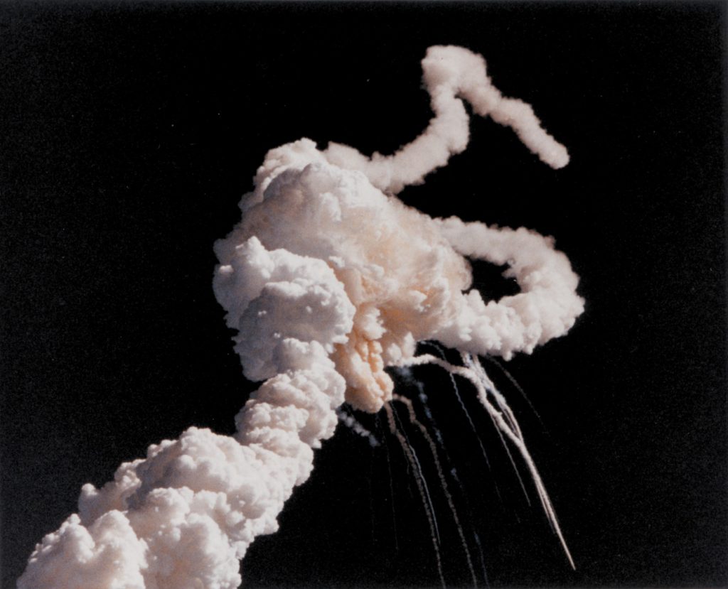 Colour photograph of a mid air explosion during the Challenger space shuttle disaster