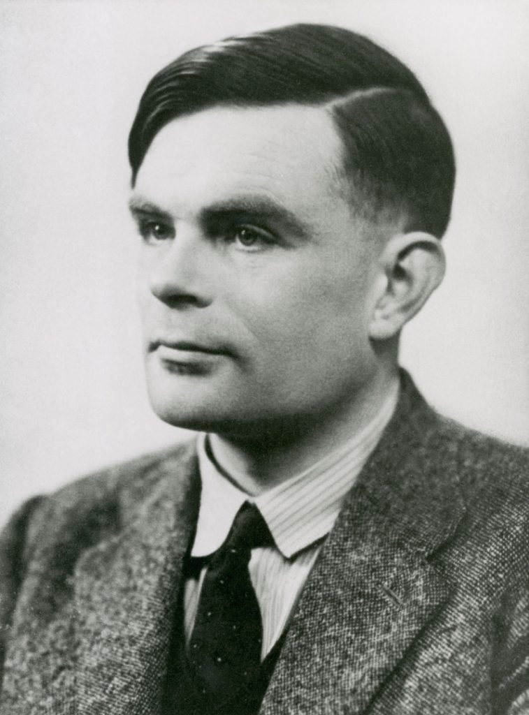 Black and white photograph portrait of Alan Turing looking to right of camera
