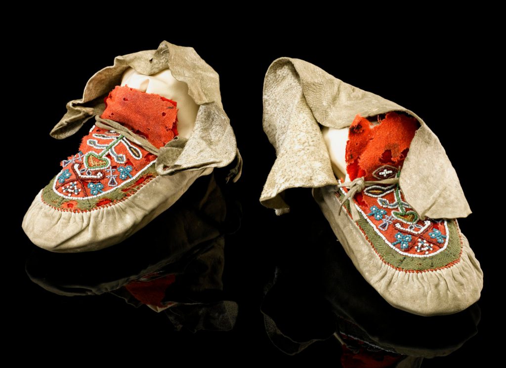 Colour photograph of a pair of aboriginal north american moccasins