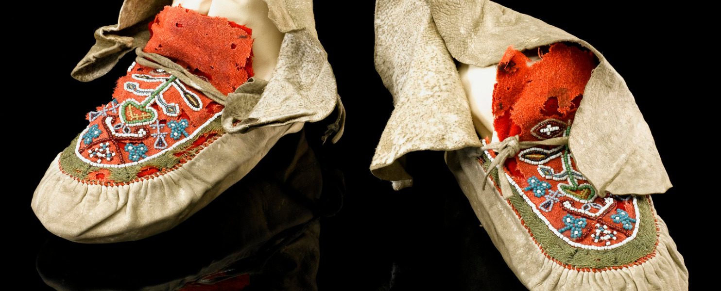 Colour photograph of a pair of aboriginal north american moccasins