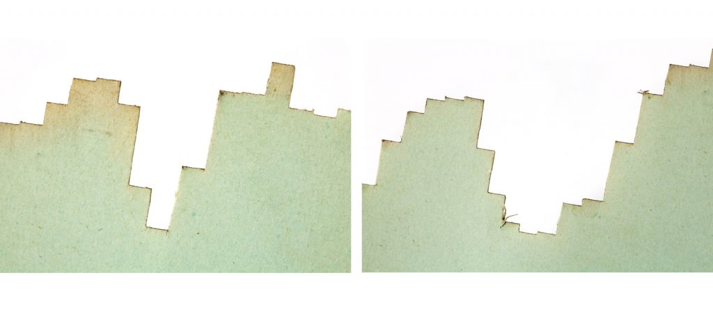 Colour photograph of two individual chart cards from a 1950s three dimensional chart showing electricity demand over time