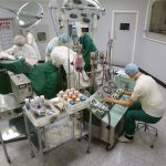 Colour photograph of a hospital surgery room diorama inside a museum exhibition