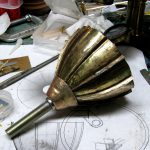 Colour photograph of a brass mouthpiece