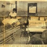 Newspaper clipping showing a nurse fixing electrodes to a patients head in a laboratory