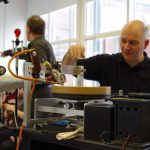 Colour photograph of a man operating the disc recording lathe
