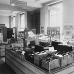 Black and white photograph showing a number of noise meters on display in the research section of an exhibition on noise at the Science Museum London