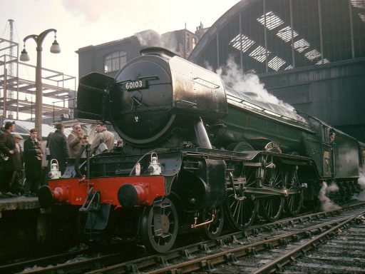 The Flying Scotsman steam train on the tracks at London Kings Cross station
