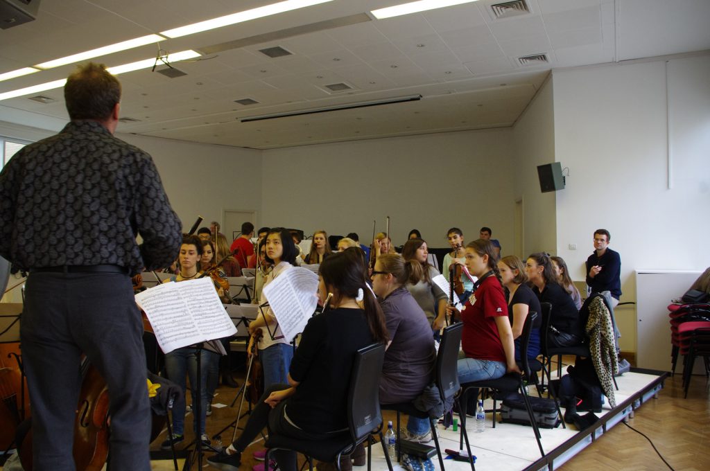 Colour photograph of the woodwinds section of the royal college of music chamber orchestra recording music to wax discs