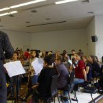 Colour photograph of the woodwinds section of the royal college of music chamber orchestra recording music to wax discs