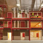 Colour photograph of a steel and hempcrete storage building under construction