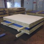 Colour photograph of the precast panels showing white magnesium silicate material on the upper surface